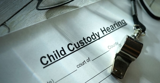 A document reading "Child Custody Hearing"