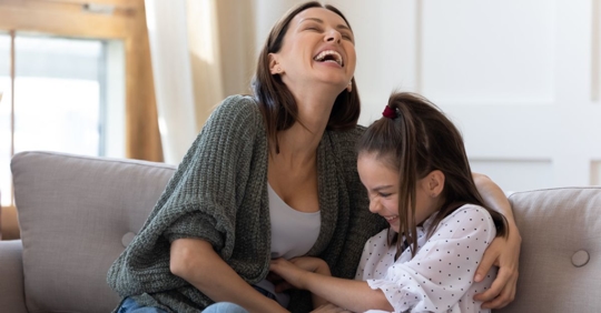 Mom and daughter laughing