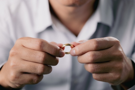 man holding wedding ring
