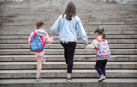 mom taking two daughters to school